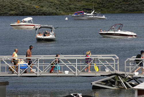 Scott Sommerdorf  |  The Salt Lake Tribune
A family heads across a bridge to the marina at Jordanelle State Park to begin ta day on the water. The park near Park City is one of the Utah state parks that serve as an urban playground due to its proximity to the Wasatch Front.