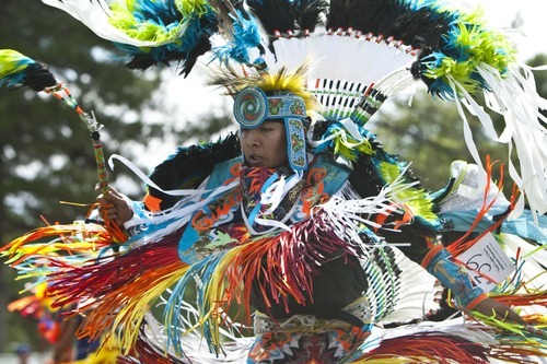 Chris Detrick | The Salt Lake Tribune 
Patrick Willie, of Orem, dances the fancy feather dance during the Native American Cultural Celebration at Liberty Park Monday July 25, 2011.