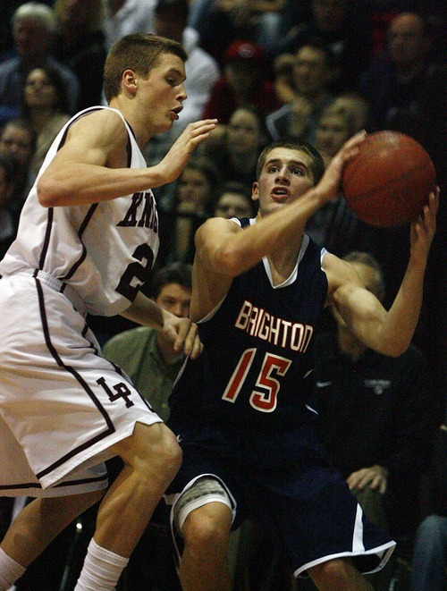 Djamila Grossman  |  The Salt Lake Tribune
Brighton High School's Corbin Miller, 15, looks to pass the ball as Lone Peak High School's Talon Shumway, 21, guards him, during a game at Lone Peak. Lone Peak won the game.