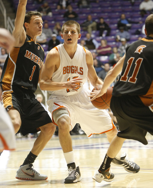 Chris Detrick | The Salt Lake Tribune 
Brighton's Corbin Miller (15) is guarded by Murray's Joel Cosby (1) during the 5A basketball tournament at the Dee Events Center on Wednesday, March 2, 2011.  Murray won the game 76-65.