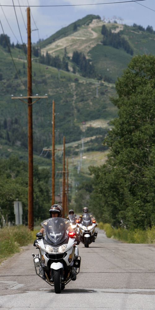 Francisco Kjolseth  |  The Salt Lake Tribune
Michelle Obama's motorcade leaves Park City on Tuesday, July 26, 2011, where she was hosting a fundraiser for her husband's reelection campaign.
