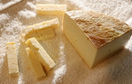 Steve Griffin  |  The Salt Lake Tribune

Stig Hansen, who owns Snowy Mt. Sheep Creamery in Eden with his wife Susan,  shows some of his Kings Peak blue cheese Thursday, July 14, 2011.  Stig is the cheesemaker and a Danish chef by trade. He started Snowy Mountain about a year ago, but his cheeses have already won prestigious national awards.