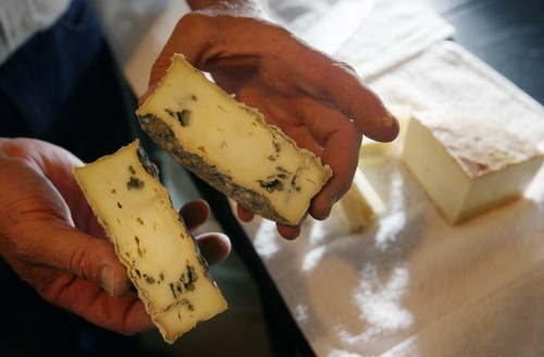 Steve Griffin  |  The Salt Lake Tribune

Stig Hansen, who owns Snowy Mt. Sheep Creamery in Eden with his wife Susan,  shows some of his Delano Peak blue cheese Thursday, July 14, 2011.