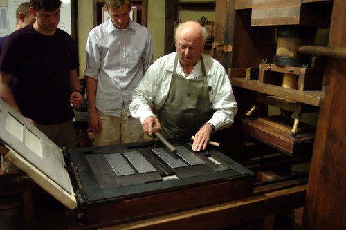 Donald W. Meyers | The Salt Lake Tribune
Jim Watkins, a historian and docent at the Crandall Historical Printing Museum in Provo, demonstrates how type for the world's first printed Bible was set at the time of Johann Gutenberg. Watkins is using a replica of Gutenberg's printing press, the first  to use movable type.