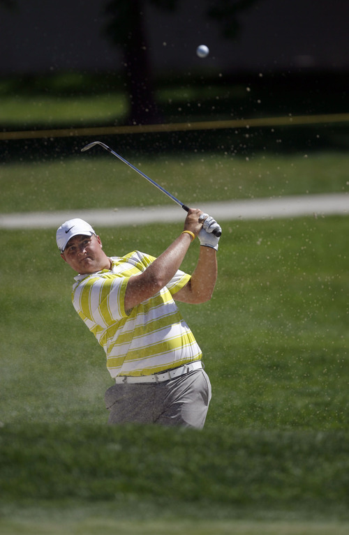 Francisco Kjolseth  |  The Salt Lake Tribune
Creighton Honeck of Austin, TX, keeps his eye on the ball as he digs out of the sand in hole 7 of the Nationwide Tour, the Triple-A of the PGA Tour, making a stop at the Willow Creek Country Club in Sandy on Thursday, July 28, 2011, for the first of four days.