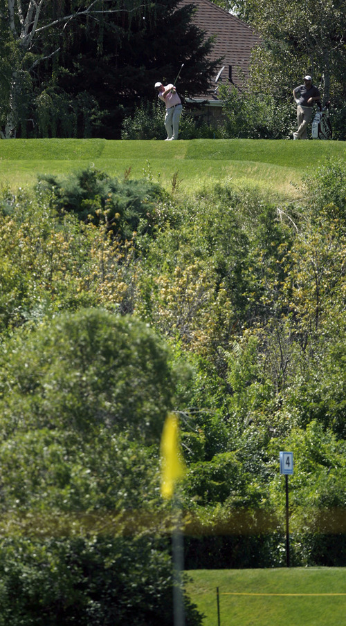 Francisco Kjolseth  |  The Salt Lake Tribune
John Kimbell of San Antonio, TX, nearly hits a hole in one on the par-3, hole 7, at the Willow Creek Golf Course, as his ball bounces a couple of inches away and hits the flag. The Nationwide Tour, the Triple-A of the PGA Tour, makes its stop at the Willow Creek Country Club in Sandy on Thursday, July 28, 2011, for the first of four days.