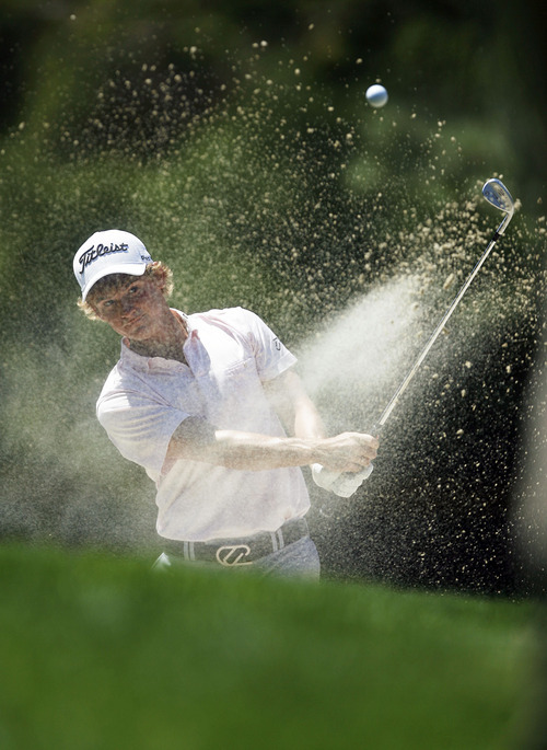 Francisco Kjolseth  |  The Salt Lake Tribune
Bud Cauley of Tuscaloosa, AL, digs out of the sand in hole 3 in the Nationwide Tour, the Triple-A of the PGA Tour, as it makes its stop at the Willow Creek Country Club in Sandy on Thursday, July 28, 2011, for the first of four days.