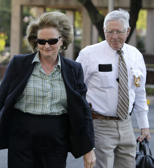 Tony Gutierrez  |  The Associated Press

District Judge Barbara Walther arrives at the Tom Green County Courthouse escorted by a law enforcement official Thursday in San Angelo, Texas. Walther is presiding over the trial of Polygamist sect leader Warren Jeffs, which began in earnest Thursday.