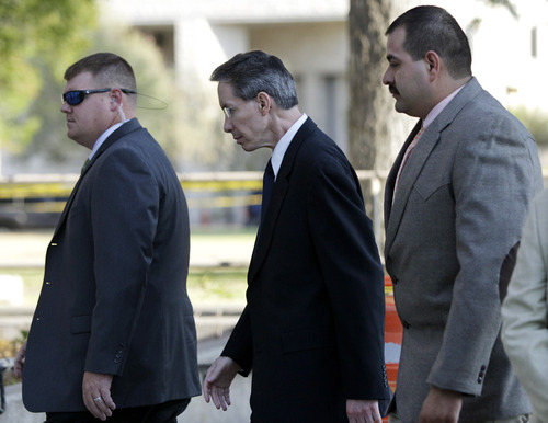 Tony Gutierrez  |  The Associated Press

Polygamist sect leader Warren Jeffs, center, arrives at the Tom Green County Courthouse escorted by law enforcement officials Thursday in San Angelo, Texas. Jeffs' much-anticipated Texas trial begins in earnest Thursday, with prosecutors claiming he sexually assaulted girls he manipulated into 