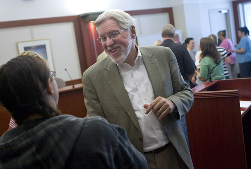 Al Hartmann   |  The Salt Lake Tribune 
Judge Robert Hilder, right, says goodbye to friends and legal staff during a farewell party in his courtroom at the Matheson Courthouse on Friday. Hilder is retiring after 17 years on the bench.