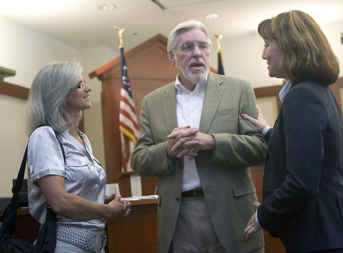 Al Hartmann   |  The Salt Lake Tribune 
Judge Robert Hilder, center, shares stories with mediator Karin Hobbs, left, and lawyer Sharon Donovan, right, during a farewell party in his courtroom at the Matheson Courthouse Friday. Both women worked in his courtroom over the years. Hilder is retiring after 17 years on the bench.
