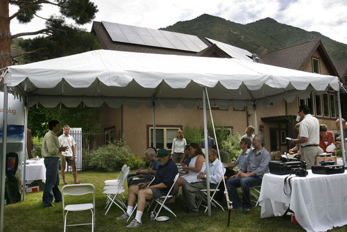 Scott Sommerdorf  |  The Salt Lake Tribune
The open house at Olympus Cove resident Bob Frey's home with twenty-two solar panels installed atop his home, Saturday July 30, 2011. Frey projects that with rebates, tax incentives and the sale of excess power, he'll make an 6 percent return on his investment. The Park City company DwellTek installed the system.