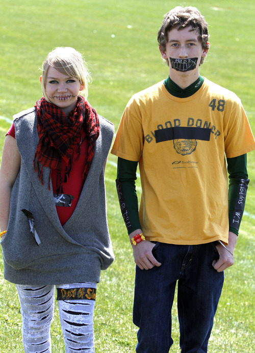 Rick Egan   |  The Salt Lake Tribune

Chandra Carlson (left) and David Vansickle, both sophomores at Kearns High, observed National Day of Silence on April 15 to raise awareness about the silencing effect of anti-LGBT bullying, including teen suicide.