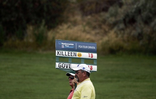 Djamila Grossman  |  The Salt Lake Tribune

People carry a sign along the fairway as J.J. Killeen and Jeff Gove play in the Utah Championship of the Nationwide Tour at Willow Creek Country Club in Sandy, Utah, on Sunday, July 31, 2011. Killeen won the Championship.