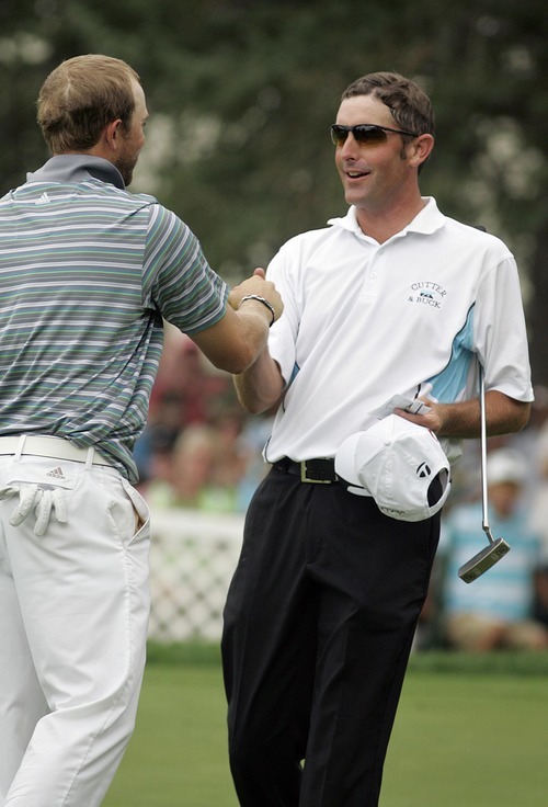 Djamila Grossman  |  The Salt Lake Tribune

J.J. Killeen and Jeff Gove shake hands after the Utah Championship of the Nationwide Tour at Willow Creek Country Club in Sandy, Utah, on Sunday, July 31, 2011. Killeen won the Championship.