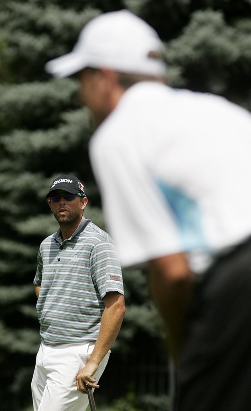 Djamila Grossman  |  The Salt Lake Tribune

J.J. Killeen watches as Jeff Gove hits from the green in the Utah Championship of the Nationwide Tour at Willow Creek Country Club in Sandy, Utah, on Sunday, July 31, 2011. Killeen won the Championship.