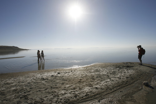 Rick Egan   |  The Salt Lake Tribune
Foreign tourists take photos on the shore of Antelope Island in 2010.