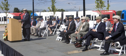 Al Hartmann  |  The Salt Lake Tribune
Michael Allegra, General Manager of Utah Transit Authority, left, speaks at opening ceremony at the West Valley Central TRAX Station Tuesday.  Seated down the row are: Greg Hughes, chairman of the UTA Board, William Millar, president, American Public Transportation Asociation, Lane Beattie, president of Salt Lake Chammber of Commerce, and Mike Winder, mayor of West Valley City.