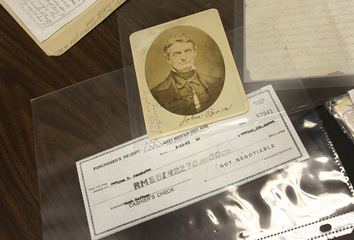 Scott Sommerdorf  |  The Salt Lake Tribune
From Brent Ashworth's collection of Hofmann memorabilia, a faked inscription on a photo of abolitionist John Brown and a Hofmann cashier's check made out in the sum of $142,270.