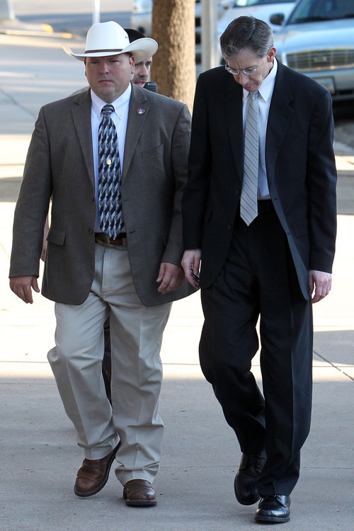 Warren Jeffs is escorted by security into the Tom Green County Courthouse, Tuesday, Aug. 2, 2011, in San Angelo, Texas.  Jeffs faces two counts of sexual assault of a child. The 55-year-old Jeffs claims his rights to religious freedom are being trampled. He is defending himself but gave no opening statement, hasn't cross-examined any state witnesses and isn't expected to call witnesses in his defense. (AP Photo/The San Angelo Standard-Times, Patrick Dove)