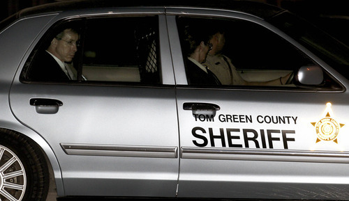 Polygamist leader Warren Jeffs, left, is driven away from the Tom Green County Courthouse by Sheriff's personnel Tuesday, Aug. 2, 2011, in San Angelo, Texas. A West Texas jury has heard audio recordings and diary accounts of polygamist leader Jeffs teaching his 14-year-old 