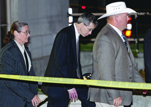 Polygamist religious leader Warren Jeffs, center, is escorted out of the Tom Green County Courthouse Tuesday, Aug. 2, 2011, in San Angelo, Texas. A West Texas jury has heard audio recordings and diary accounts of Jeffs teaching his 14-year-old 