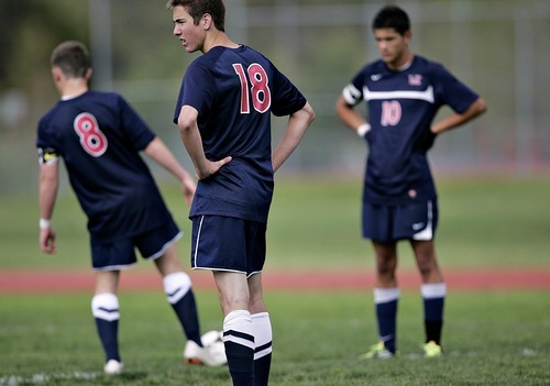 Djamila Grossman  |  The Salt Lake Tribune

Woods Cross High School's Justin Ward (8), Ethan Cope (18) and  Luis Calquin (10) look on as their team falls behind against Springville High School at Springville, Utah, on Wednesday, May 18, 2011. Springville won the game.