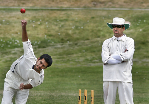 Scott Sommerdorf  |  The Salt Lake Tribune
Salt Lake Cricket Union captain Nasir Khan (right), a former professional cricket player. looks on as Omar Javed 