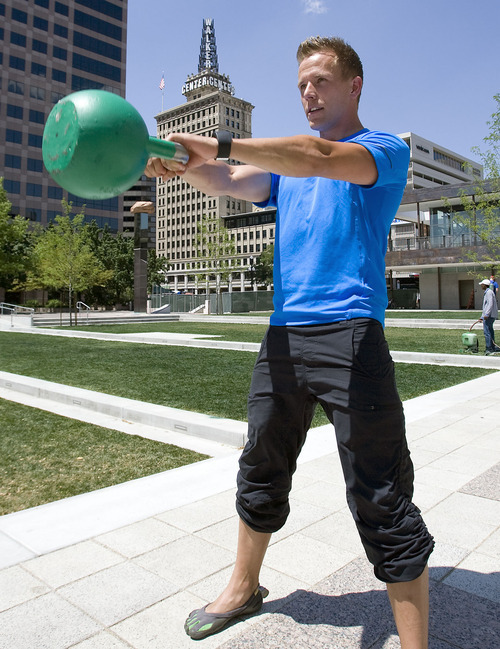 Al Hartmann  |  The Salt Lake Tribune 
Blake Robinson works out with a 45 pound kettle bell, a tool that went out of style but is making a comeback.  Swinging the bell with correct form works out the hamstrings, glutes, core, back and shoulder muscles.