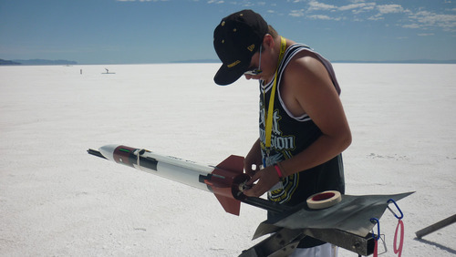 Cimaron Neuegebauer | The Salt Lake Tribune
Chris Baker, 16, of Salt Lake sets up his homemade model rocket
during the 16th Annual Utah Rocket Club's Hellfire event at the
Bonneville Salt Flats on Thursday.