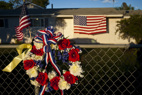 Chris Detrick  |  The Salt Lake Tribune
The American Legion and Gold Cross Ambulance placed flowers and American flags outside of Tracy Beede's home in Vernal Friday August 5, 2011. 21-year-old Marine Sgt. Daniel Gurr died Friday in Malozai, in the Sangin district of the deadly Helmand Province of Afghanistan, shot in the head by small-arms fire while he was on patrol.