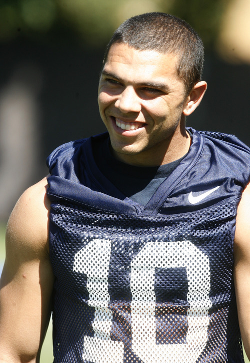 Rick Egan   |  The Salt Lake Tribune

BYU running back J.J. DiLuigi (10) at football practice, at BYU, Saturday, August 6, 2011