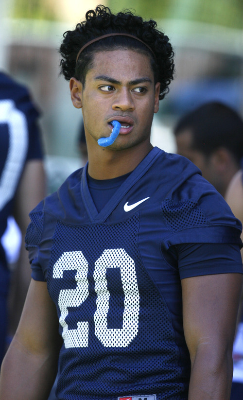 Rick Egan   |  The Salt Lake Tribune

BYU running back Joshua Quezada (20) at football practice, at BYU, Saturday, August 6, 2011