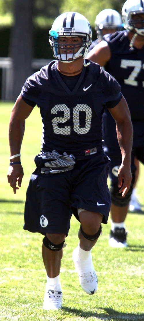 Rick Egan   |  The Salt Lake Tribune

BYU running back Joshua Quezada (20) runs a drill during practice, at BYU, Saturday, August 6, 2011