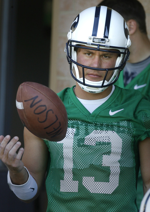 Rick Egan   |  The Salt Lake Tribune

BYU QB Riley Nelson (13) at the opening of Fall Football camp at BYU, Saturday, August 6, 2011