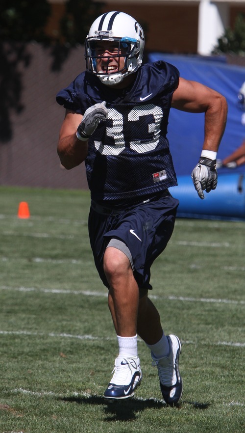 Rick Egan   |  The Salt Lake Tribune

BYU running back Bryan Kariya, (33) runs a drill during practice, at BYU, Saturday, August 6, 2011