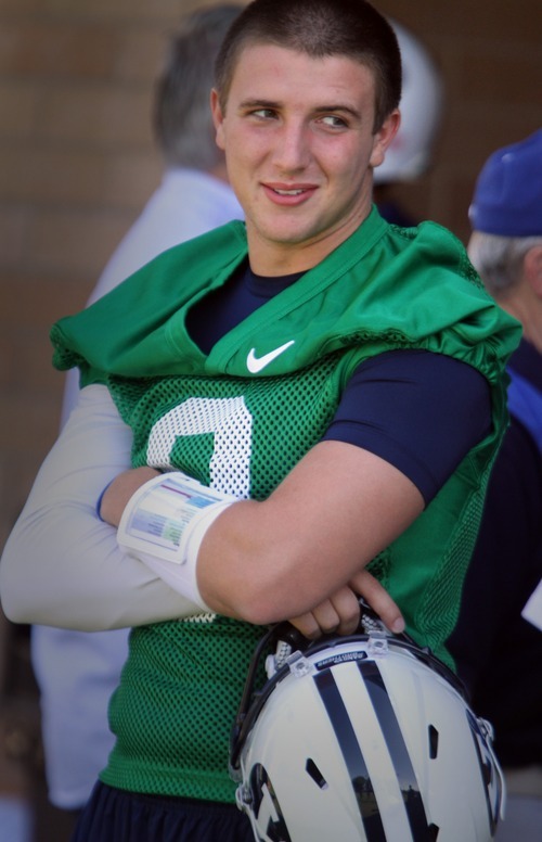 Rick Egan   |  The Salt Lake Tribune

 BYU QB, Jake Heaps, watches from the shade, before taking the field for the opening of Fall Football Camp at BYU, Saturday, August 6, 2011