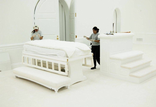 Forensic technicians exmaine a bed in the FLDS Church's temple at the Yearning for Zion Ranch in Texas. Prosecutors in Warren Jeffs' child sexual abuse trial have presented evidence that Jeffs had sex with underage girls in the temple.  Photo courtesy of Sam Brower