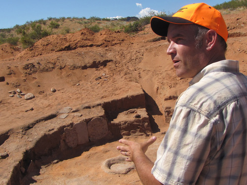 Mark Havnes  |  The Salt Lake Tribune
UDOT archaeologist Eric Hansen at an ancient pit house on Tuesday. Archaeologists are documenting the sites north of Washington City in Washington County on BLM land as required before the state agency lays down a new highway.