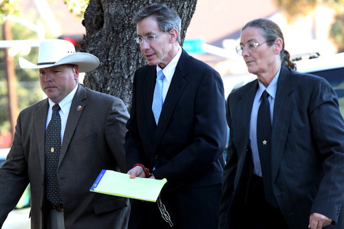 Warren Jeffs is taken into the side entrance of the Tom Green County Courthouse in San Angelo, Texas, on Monday, Aug. 8, 2011. Jurors convicted Jeffs last week of sexually assaulting two girls, ages 12 and 15, whom he had taken as brides. He faces up to life in prison. Jeffs has led the Fundamentalist Church of Jesus Christ of Latter-Day Saints since 2002. (AP Photo/ San Angelo Standard-Times, Patrick Dove)