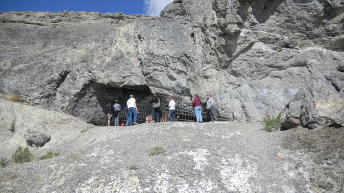 Tom Wharton  |  The Salt Lake Tribune
Visitors peer into the outside of Danger Cave near Wendover.