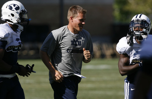 Francisco Kjolseth  |  The Salt Lake Tribune&#xA;BYU's newest coaching hire, linebackers coach Nick Howell gets his players ready during practice on Wed. Aug. 18, 2010. receiver Luke Ashworth &#xA;Provo, Aug. 18, 2010.