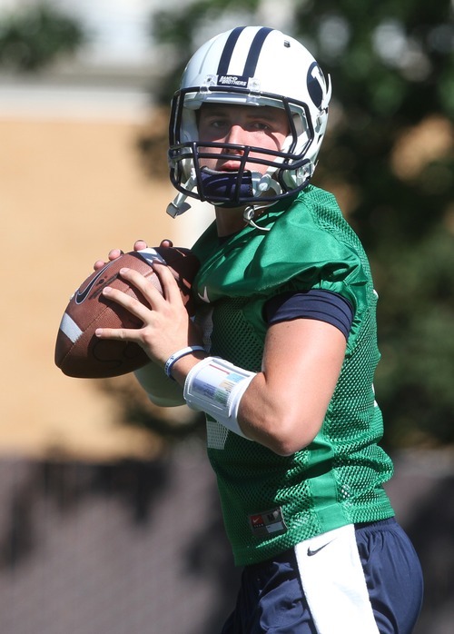 Rick Egan   |  The Salt Lake Tribune

 BYU QB, Jake Heaps, throws the ball during practice at the Fall Football Camp at BYU, Saturday, August 6, 2011