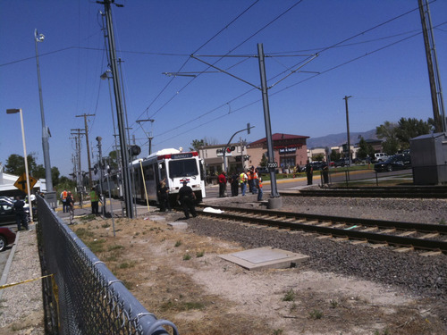 Rick Egan  |  The Salt Lake Tribune
Officers attend to the scene of a fatal TRAX accident involving a pedestrian Wednesday, Aug. 10, 2011.