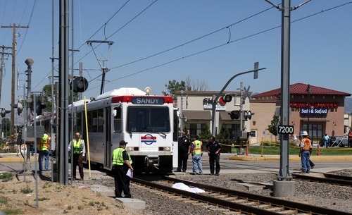 Rick Egan   |  The Salt Lake Tribune

A woman was hit by a TRAX train and killed as she was walking alongside the tracks at the intersection of 7200 South, Wednesday, Aug. 10, 2011.
