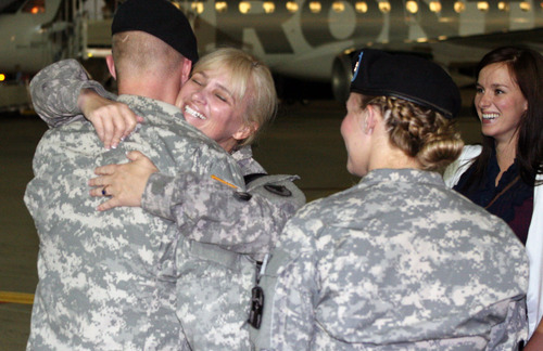Jason Olson  |  The Salt Lake Tribune
Provo councilwoman Laura Cabanilla is hugged by her son Cliff, left, Paige, second from right and Sierra, right, after touching down at the Provo Airport on Thursday. Cabanilla was returning from service in Iraq.
