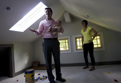 Djamila Grossman  |  The Salt Lake Tribune

Marty and Jessica Patch and their daughter Penelope, 4 months,  talk about their energy-efficient home in Salt Lake City, Utah, on Thursday, Aug. 4, 2011. The family won the Rocky Mountain Power WattSmart video contest.
