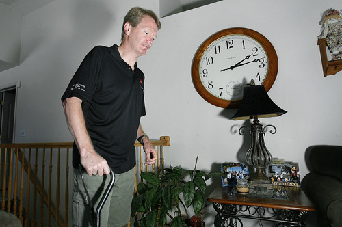 Scott Sommerdorf  |  The Salt Lake Tribune
Alan Alderman walks past a large clock in his South Jordan home. He said, 