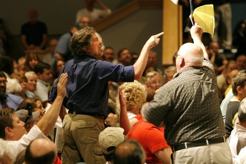 File Photo  |  The Salt Lake Tribune
Rep. Jason Chaffetz, R-Utah, is holding four town hall meetings next week -- all of them outside his district. Congress members are returning to their home states at a time when a new poll shows voter disapproval of Congress is at an all-time high. In this file photo from 2009, audience members shouted and argued during a Chaffetz town hall meeting in South Jordan. One of the big issues at the time was President Barack Obama's health care reform.