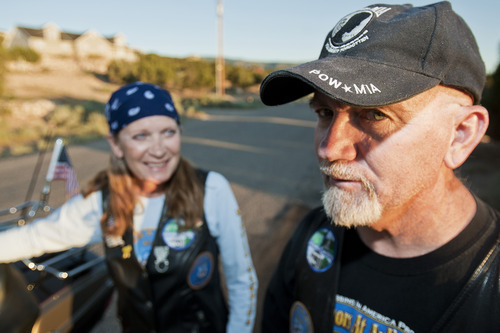 Kina Graves | For The Salt Lake Tribune
Crystal Graves looks at her husband Roger as they stand next to their Harley outside their home in Cedar City on Tuesday, August 9.